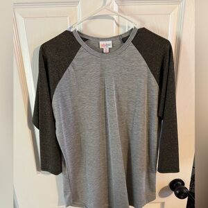 LuLaRoe Heather Gray Randy with gold sparkle sleeves. Size Medium